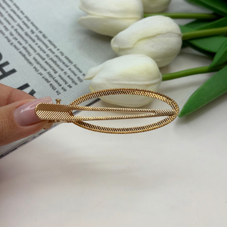 گیره مو انبری طرح بیضی طلایی تراش دار 6.5cm