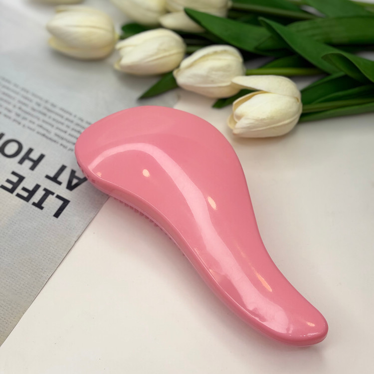 برس مو گره بازکن مدل منحنی مناسب موهای فر و صاف رنگ صورتی ملایم